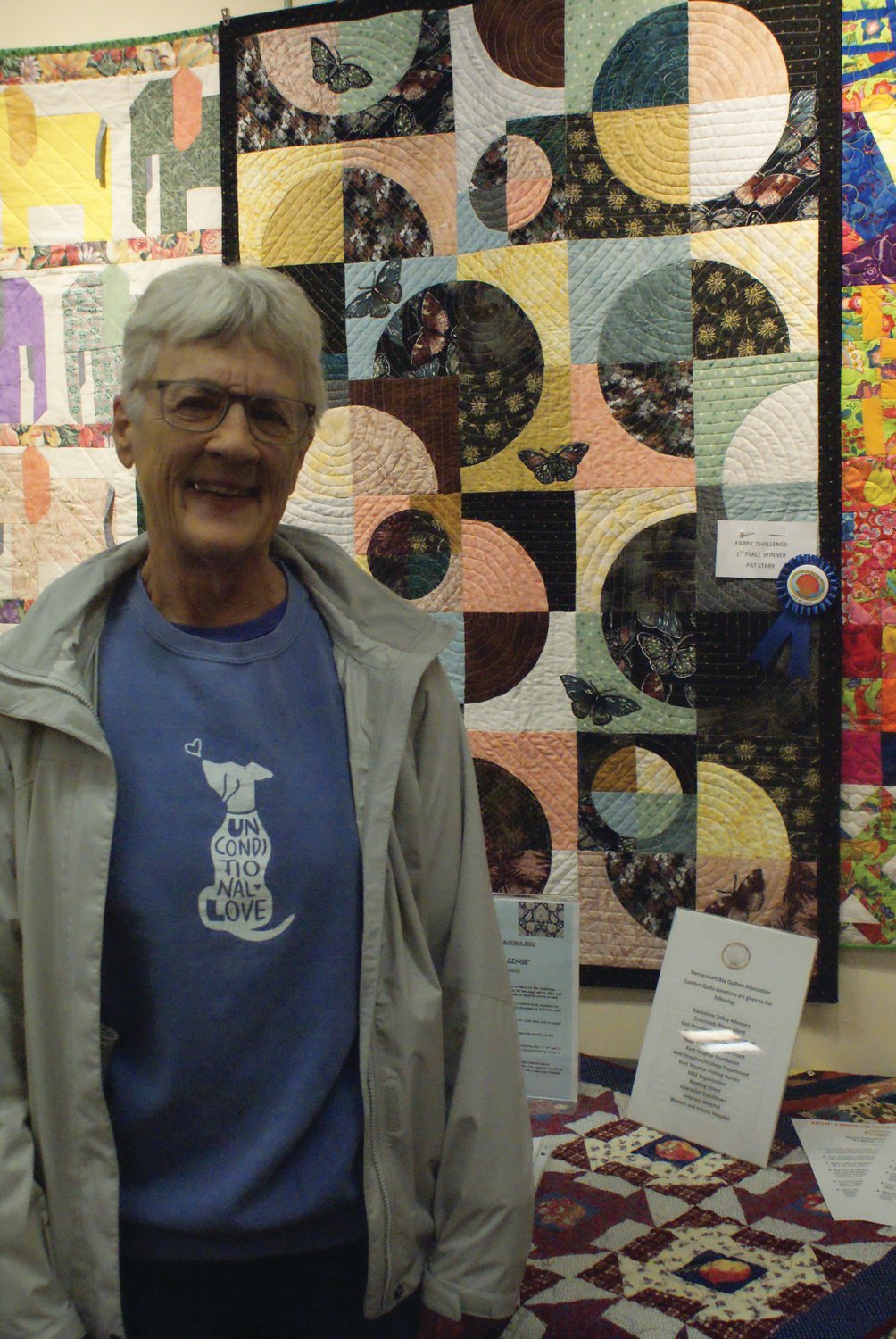 BUTTERFLIES AROUND THE MOON: Pat Stark took home first place in the Narragansett Bay Quilters’ Association’s fabric challenge. She said none of her material went together, so she just material with butterflies on it to create a connection throughout the piece.